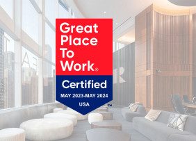 Great Place to Work badge overlaid on photo of NAR Chicago office sky level
