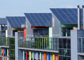 Colorful building with rooftop solar panels
