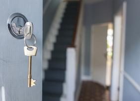 Key in lock of open house door