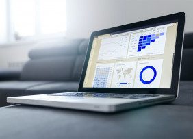 Laptop displaying data charts
