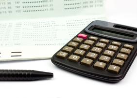 Passbook, pen, and calculator