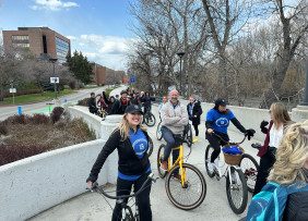 Denise Lundy and Kenny Parcell line up with fellow REALTORS® for a bike ride along the Boise River. 