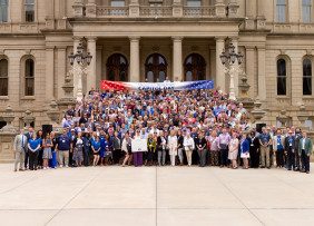 Michigan REALTORS® members gather on the steps of the Capitol Building for REALTOR® Day in Lansing, MI