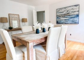 A newly redesigned and stage dining room space with light-toned furnishings for a light and airy look
