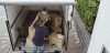 Couple loading boxes in moving truck
