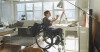 Woman in wheelchair at easel