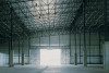 Empty warehouse, light shining through door