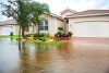 House with flooded front lawn and driveway