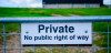 Private sign on fence around farmland