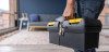 Contractor carrying toolbox in home