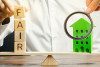 Wooden blocks with the word Fair and a wooden house
